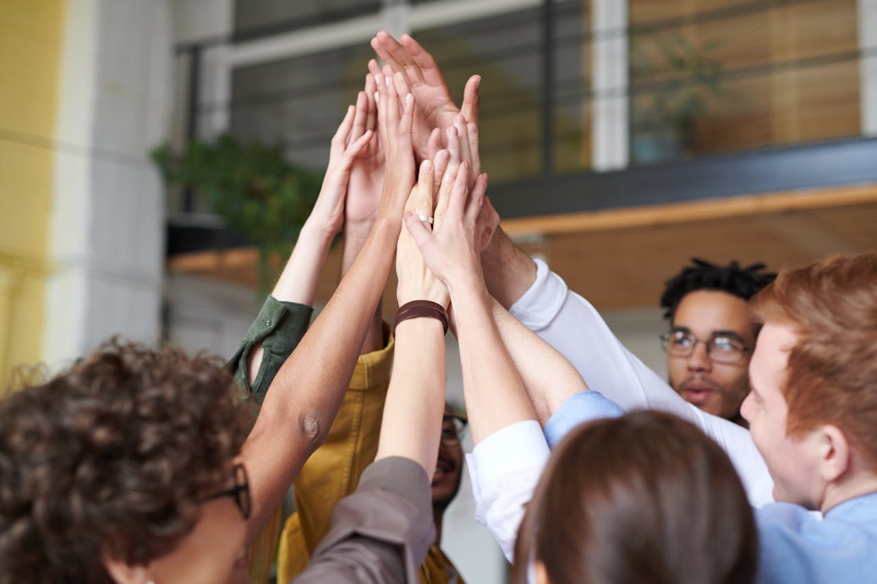 Colleagues sharing a group high-five